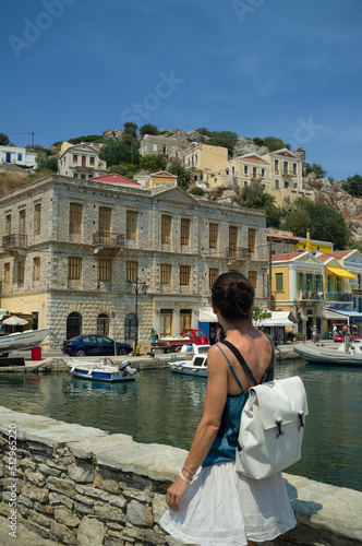 Woman in Symi greek island coast mediterranean village 