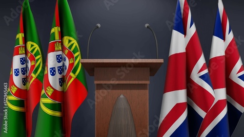 Fototapeta Naklejka Na Ścianę i Meble -  Flags of Portugal and United Kingdom at international meeting or negotiations press conference. Podium speaker tribune with flags and coat arms. 3d rendering