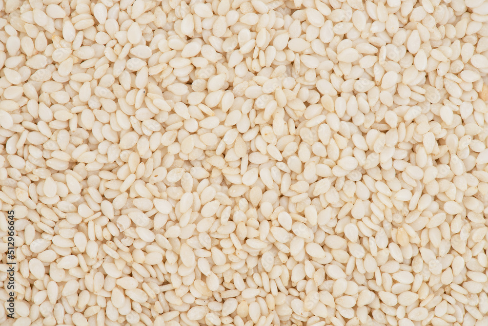 White sesame seeds ,texture and surface background. White sesame seeds ,texture and surface background.