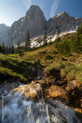 Small river flowing in the Tannheimer Valley near Mountain Gimpel , rote Flüh photo