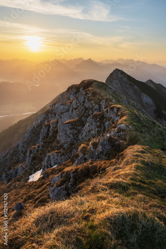 Top of mountain Große Schlicke at sunrise with valley view of Schwangau and Füssen. Tannheimer Valley, Tyrol, Austria