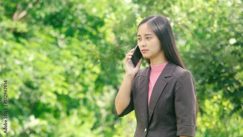 Young businesswoman making a call with a smile Young businesswoman making a call with a smile