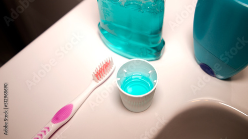 fluoride cap and toothbrush in the bathroom photo