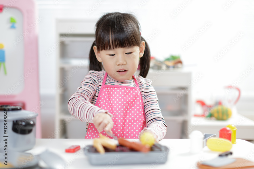 young girl pretend play food preparing at home young girl pretend play food preparing at home