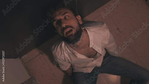 Wallpaper Mural drugs, addiction - stoned man with drug-twisted eyes sitting on the ground  Torontodigital.ca