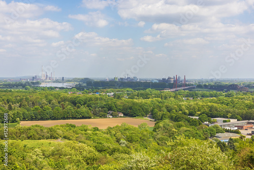 Factories in the Ruhr Area, seen from the Halde Rheinpreussen with the bridges over the Rhine leading towards Duisburg photo