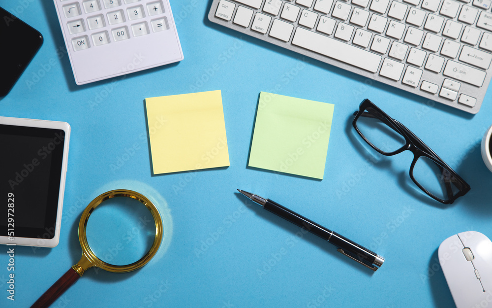 Empty sticky note with a business objects. Empty sticky note with a business objects.