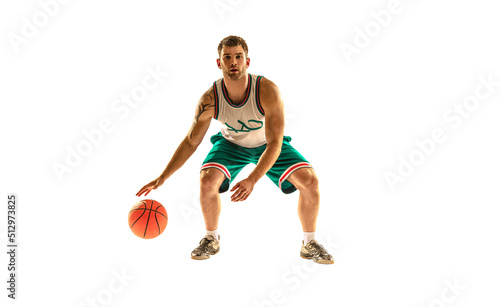 Young arabian muscular basketball player in action, motion isolated on white background. Concept of sport, movement, energy and dynamic, healthy lifestyle. Training, practicing.
