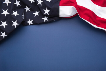 The flag of the United States of America on blue background with copy space
