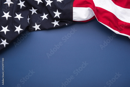 The flag of the United States of America on blue background with copy space