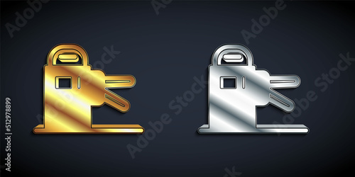 Gold and silver Turnstile icon isolated on black background. Long shadow style. Vector
