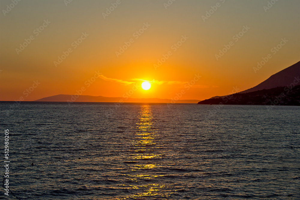 landscape a bright colourful sunset at sea. Adriatic Sea, Croatia landscape a bright colourful sunset at sea. Adriatic Sea, Croatia