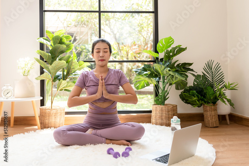 Lifestyle woman yoga exercise and pose for healthy life.  Young girl or people pose balance body vital zen and meditation for workout and fitness sport in living room on line. Health care Concept
