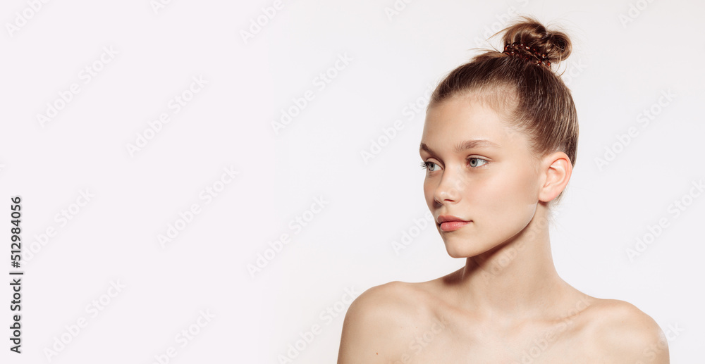 Portrait of young, beautiful and healthy girl with well-kept skin isolated on white background. The spa, surgery, face lifting and skin care concept. Flyer Portrait of young, beautiful and healthy girl with well-kept skin isolated on white background. The spa, surgery, face lifting and skin care concept. Flyer