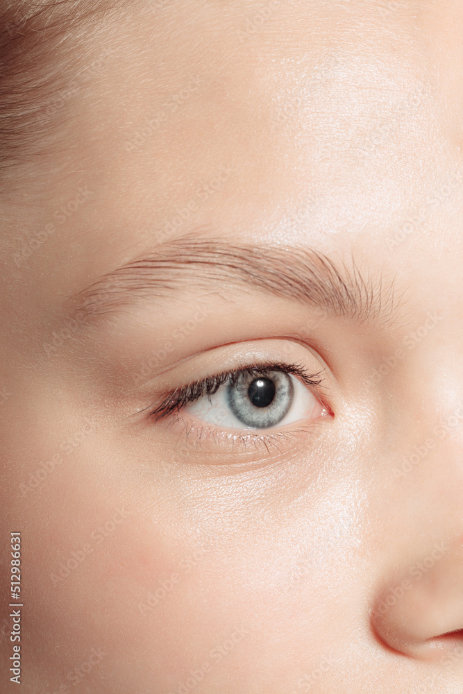 Blue eyes. Close up young girl's part of face. Concept of cosmetics, makeup, natural and eco treatment, skin care.
