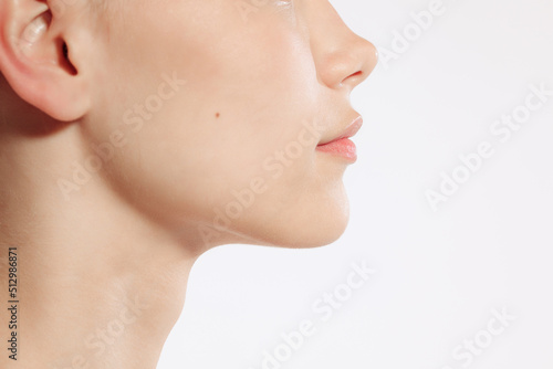 Flyer. Closeup female lips, cheeks and nose isolated over white studio background. Concept of cosmetology, skincare, cosmetics, plastic surgery, ad