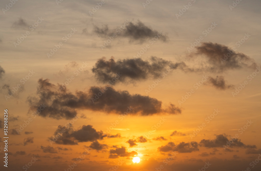 Golden sunrise sky with clouds and sun Golden sunrise sky with clouds and sun