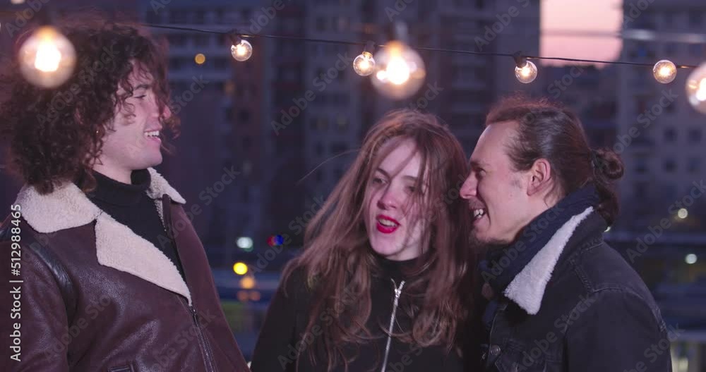 friendship, fun - three friends on the terrace have fun singing and dancing friendship, fun - three friends on the terrace have fun singing and dancing