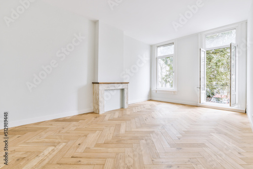 Unfurnished modern room with wooden floor photo