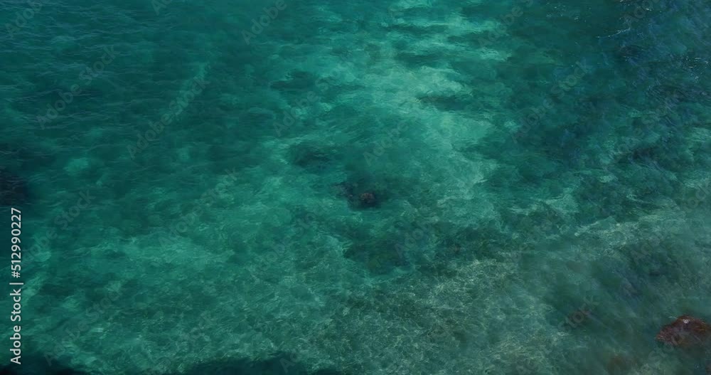 Blue azure turquoise sea water texture, a view and background of transparent clear ocean surface. Nobody. Coastal current. Deep sea bottom. Blue azure turquoise sea water texture, a view and background of transparent clear ocean surface. Nobody. Coastal current. Deep sea bottom.