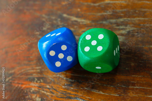 Two dice that are about to be rolled
