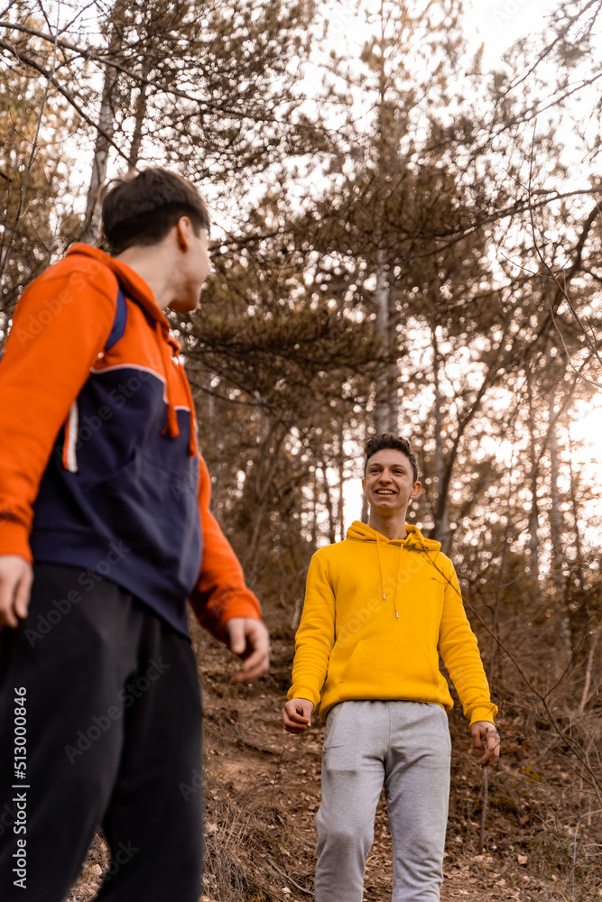 Hiking and laughing together in the forest Hiking and laughing together in the forest