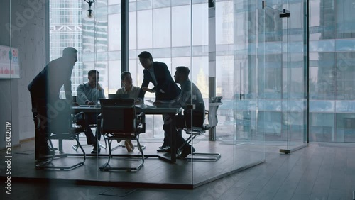 Teamwork: young business people discussing holding a presentation in modern office