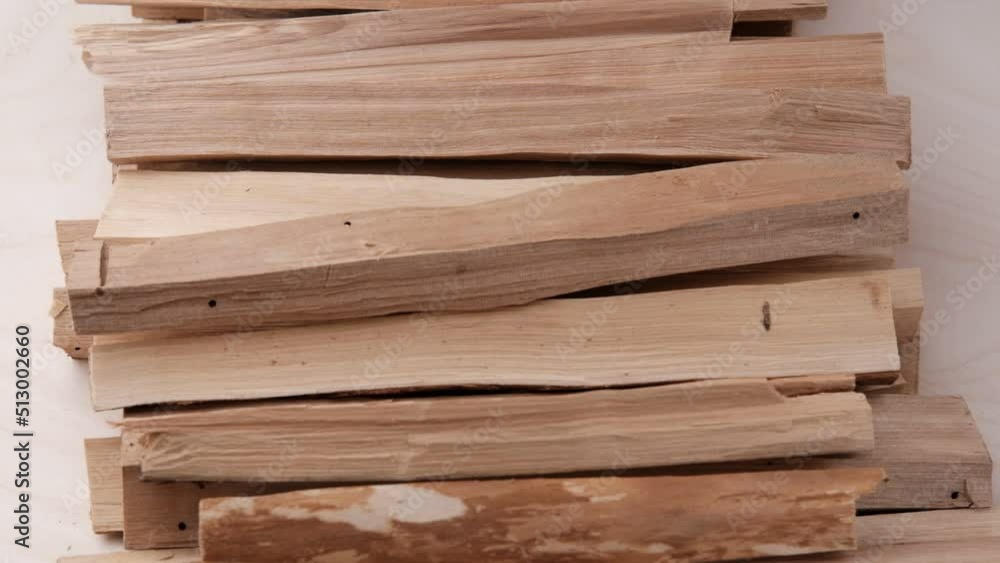 Oblong birch firewood for furnaces and fireplaces, stacked on top of each other and rotated. Slow motion. Oblong birch firewood for furnaces and fireplaces, stacked on top of each other and rotated. Slow motion.
