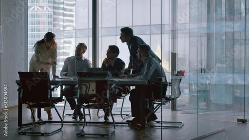 Corporate teamwork in the middle of a working day in a workplace