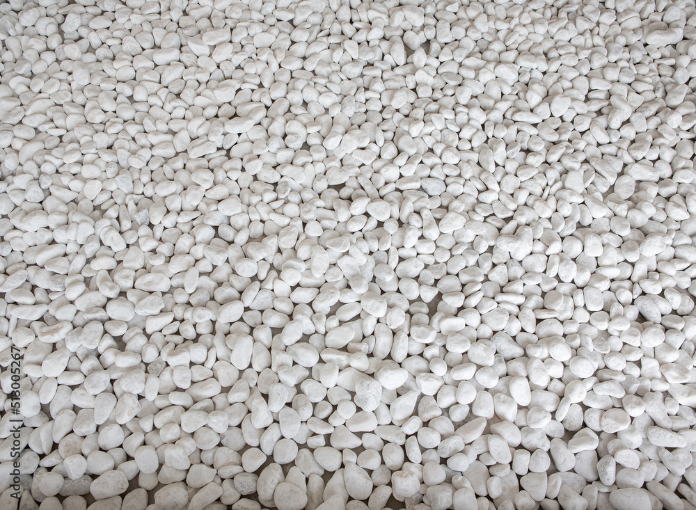 white pebbles laid out as a walkway white pebbles laid out as a walkway