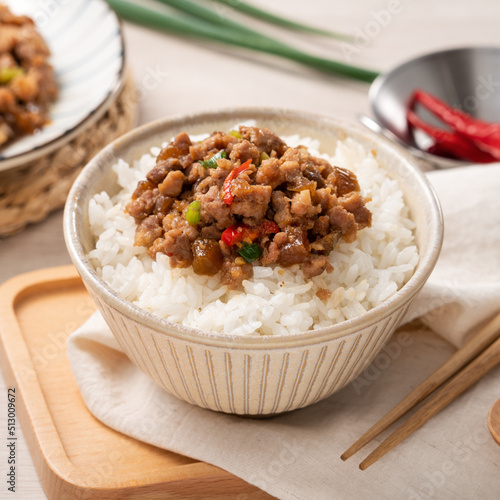 Taiwanese fried minced pork with pickled cucumber on rice named GUA ZI ROU FAN.