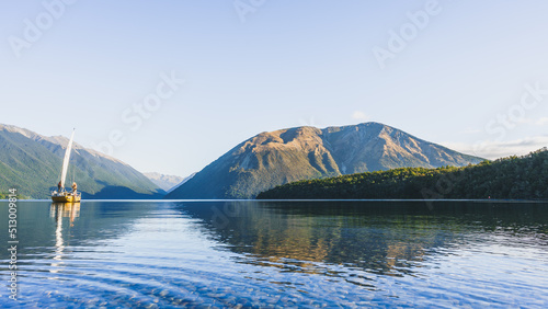 Sailing boat at Nelson Lakes National park in New Zealand photo