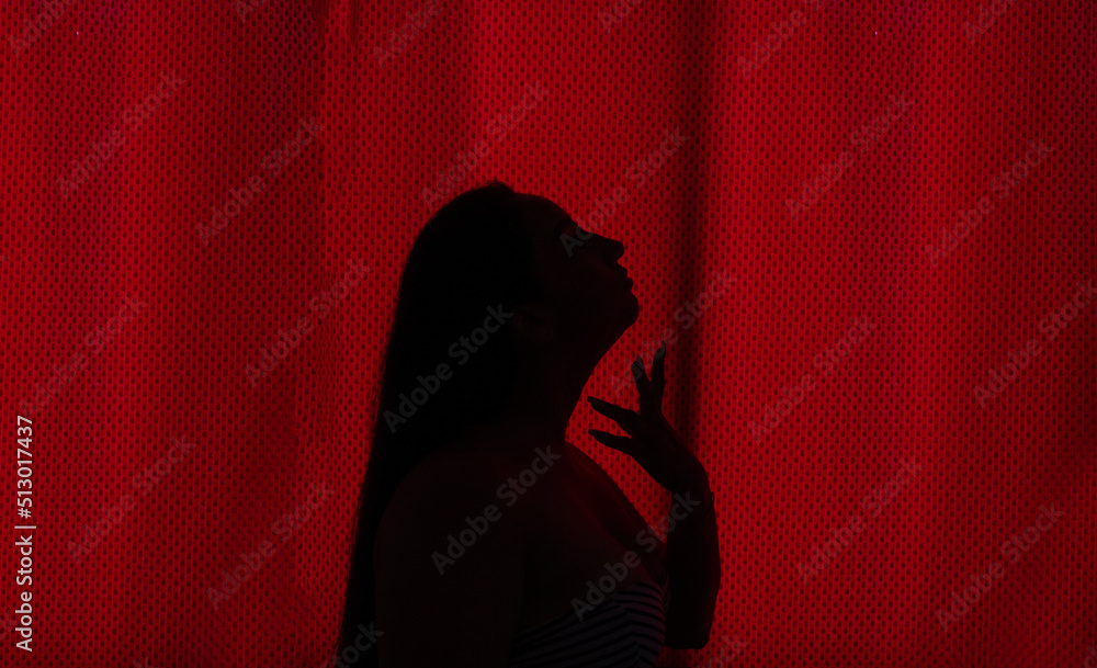 red backlight portrait of sexy big breasted woman red backlight portrait of sexy big breasted woman