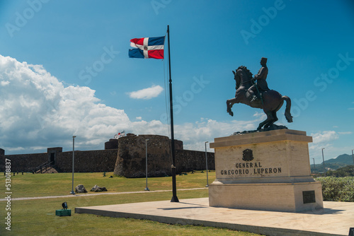 View of the fortress Fortaleza San Felipe and General Gregorio Luperon statue in Puerto Plata photo