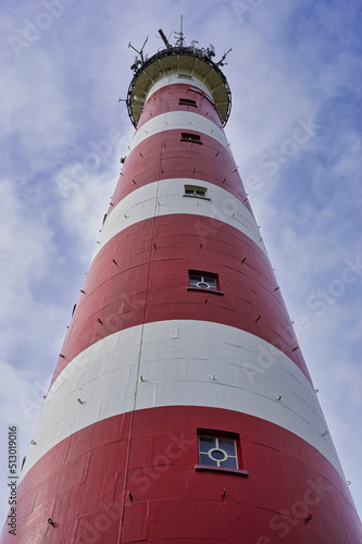 Vertical shot of the Bornrif Lighthouse on the Ameland island, Netherlands photo