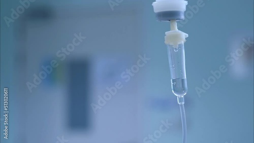 Dripping saline, Dripping medical perfusion close up equipment in clinic background, Medical equipment, Saline Solution IV Drip Fluid for Infusion in Hospital. Intravenous drip in operation room.	