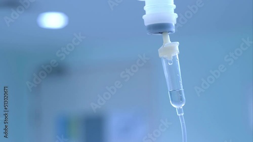 Dripping saline, Dripping medical perfusion close up equipment in clinic background, Medical equipment, Saline Solution IV Drip Fluid for Infusion in Hospital. Intravenous drip in operation room.	