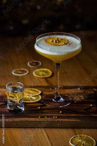Glass of porn star martini on dark background
