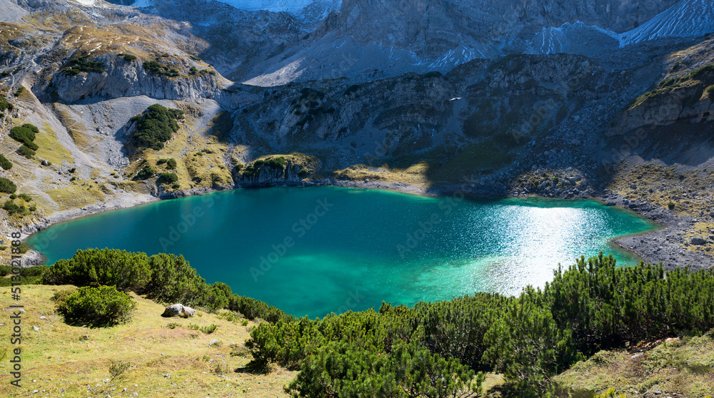 closeup of blue-green lake Drachensee, hiking destination Ehrwald