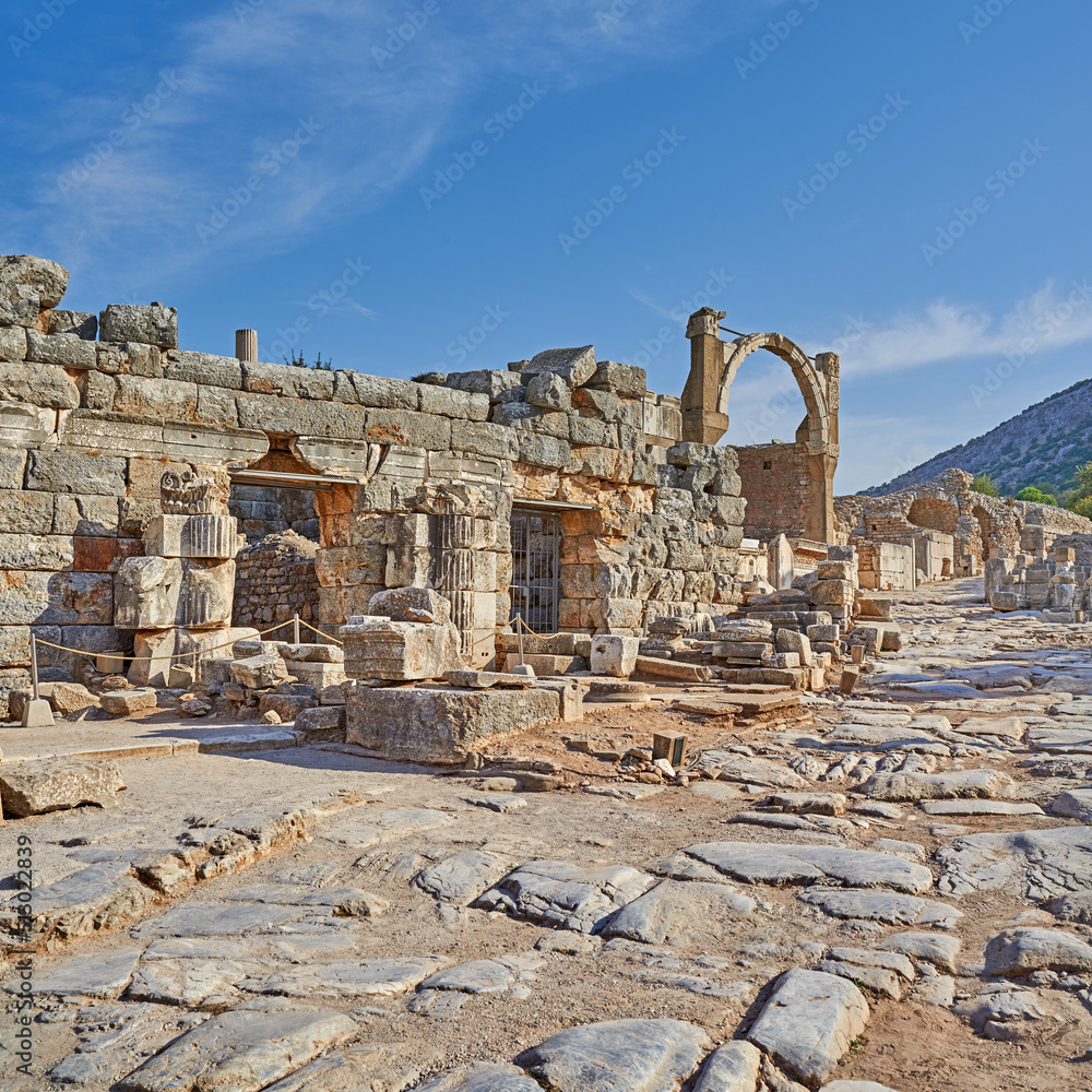 Obraz premium Ancient city ruins of Ephesus in Turkey during the day. Traveling abroad and overseas for holiday, vacation and tourism. Excavated remains of historical building from Turkish history and culture