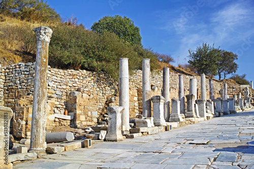 Historical Turkey pillars Ephesus in an ancient city. Excavated remains of historical building stone in Turkish history and culture. Ruin of ancient roman architecture in a popular tourism attraction