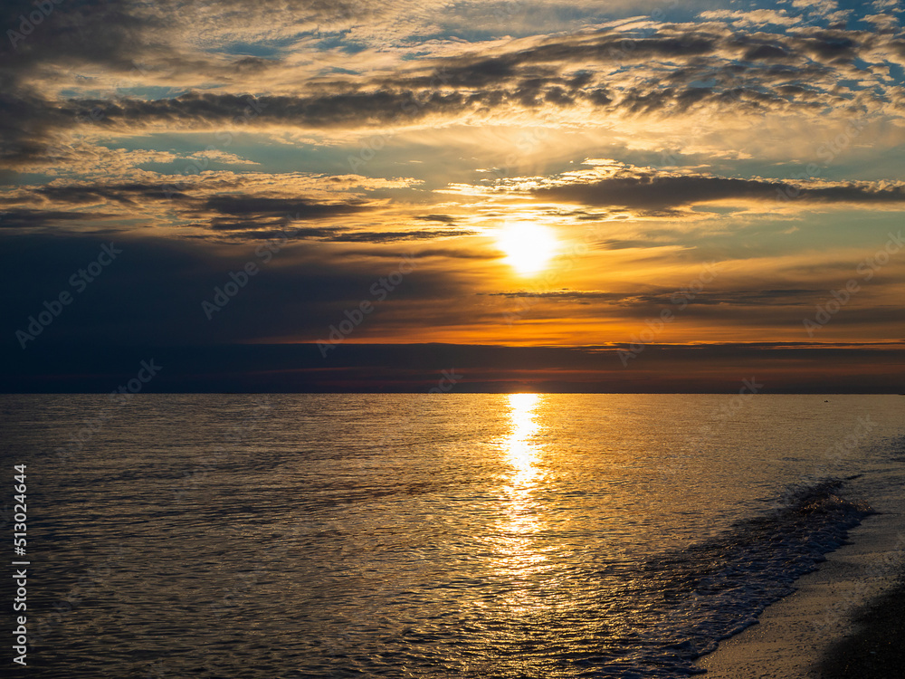 Obraz premium Picturesque view of the sea against the sky during sunset. Beautiful sunset on the sea beach