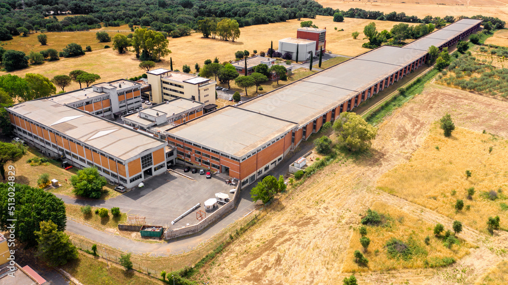 Aerial view on a long industrial warehouse.