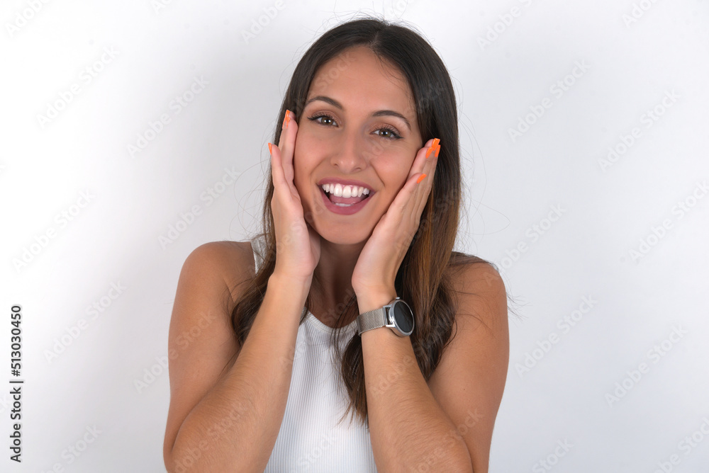 young beautiful caucasian woman wearing white Top over white background Pleasant looking cheerful, Happy reaction young beautiful caucasian woman wearing white Top over white background Pleasant looking cheerful, Happy reaction