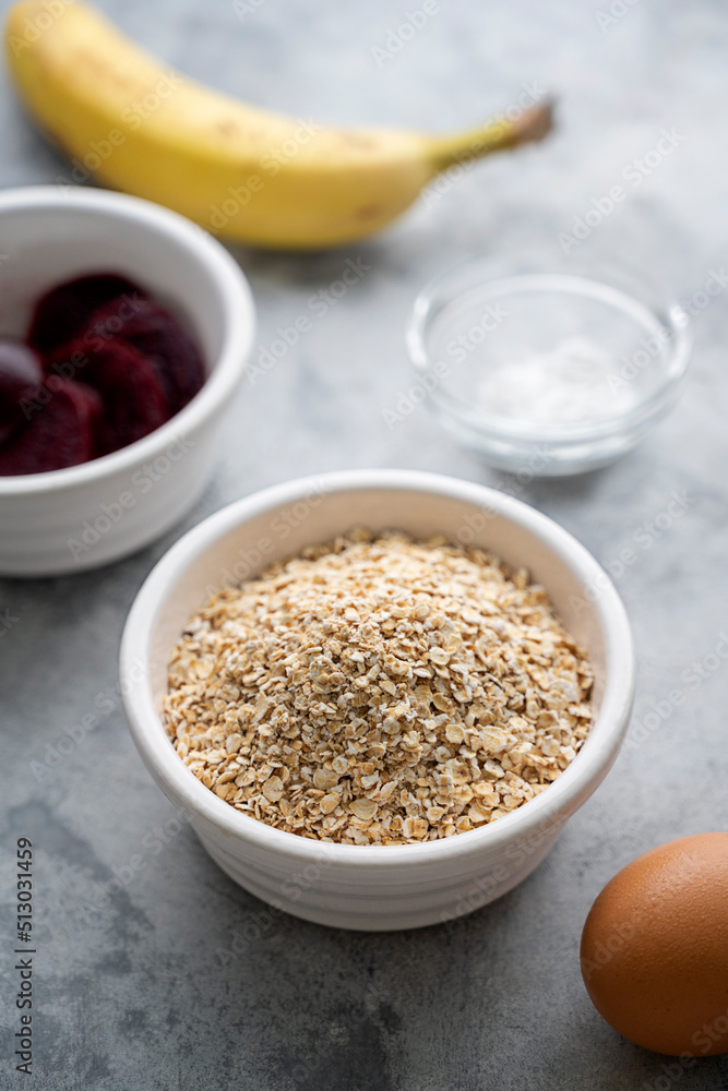 Ingredients for beetroot pancakes, banana, oats, an egg, beetroot. Cooking healthy food. Ingredients for beetroot pancakes, banana, oats, an egg, beetroot. Cooking healthy food.
