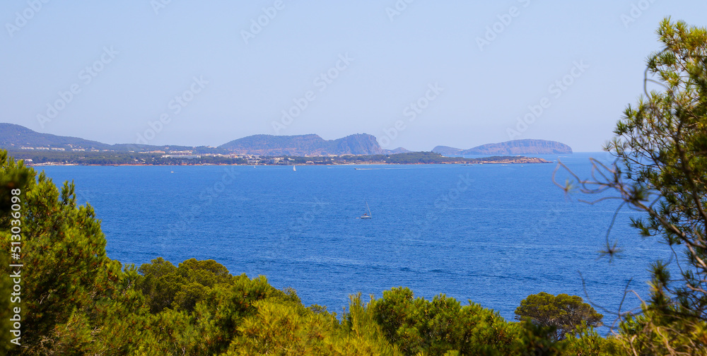 Panoramic view of Santa Eulària des Riu as seen from Cala Blanca across the Mediterranean Sea in the southeast of Ibiza Island in the Balearic Islands, Spain