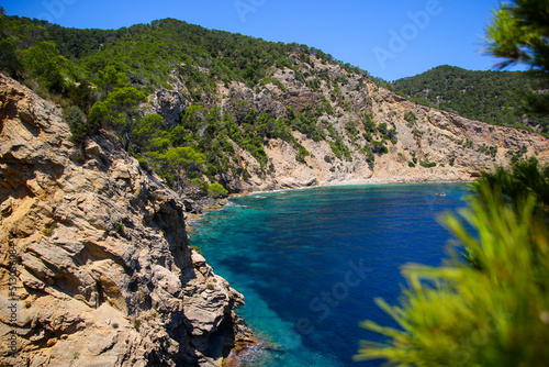 Cala Blanca, a tiny bay with turquoise waters in the southeast of Ibiza Island in the Mediterranean Sea - Pine covered cliffs overlooking the Mediterranean Sea near Cala Llonga © Alexandre ROSA