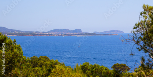 Panoramic view of Santa Eulària des Riu as seen from Cala Blanca across the Mediterranean Sea in the southeast of Ibiza Island in the Balearic Islands, Spain photo