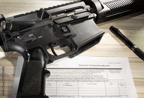 AR-15 and background check form for its purchase photo