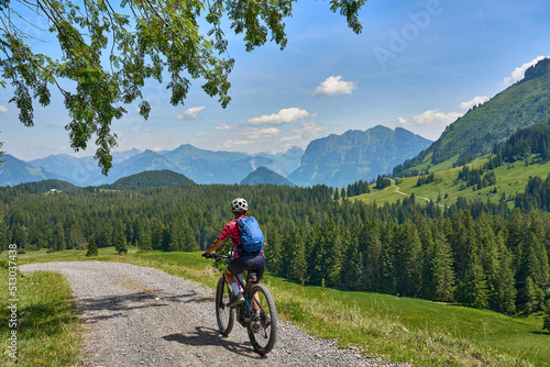 nice, active senior woman underway with her electric mountain bike in the Bregenz Wald near Dornbirn, VorarlbergAlps, Austria 